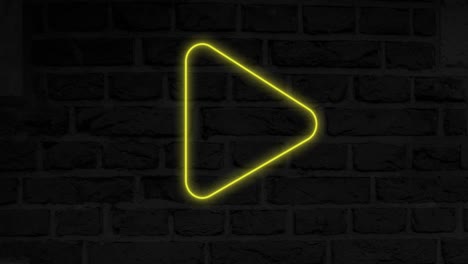 animación del icono del botón de reproducción de neón brillante en la pared de ladrillo