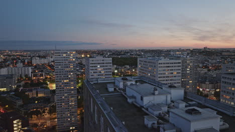 a serene aerial view featuring the district under moonlight, adding a mystical t