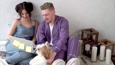 couple relaxing at home with a dog