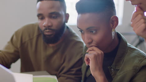 happy business people celebrating corporate success black colleagues enjoying successful victory clapping watching laptop in cheerful office workplace close up