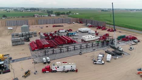 aerial view of a hydraulic fracturing (fracking) site in a rural landscape