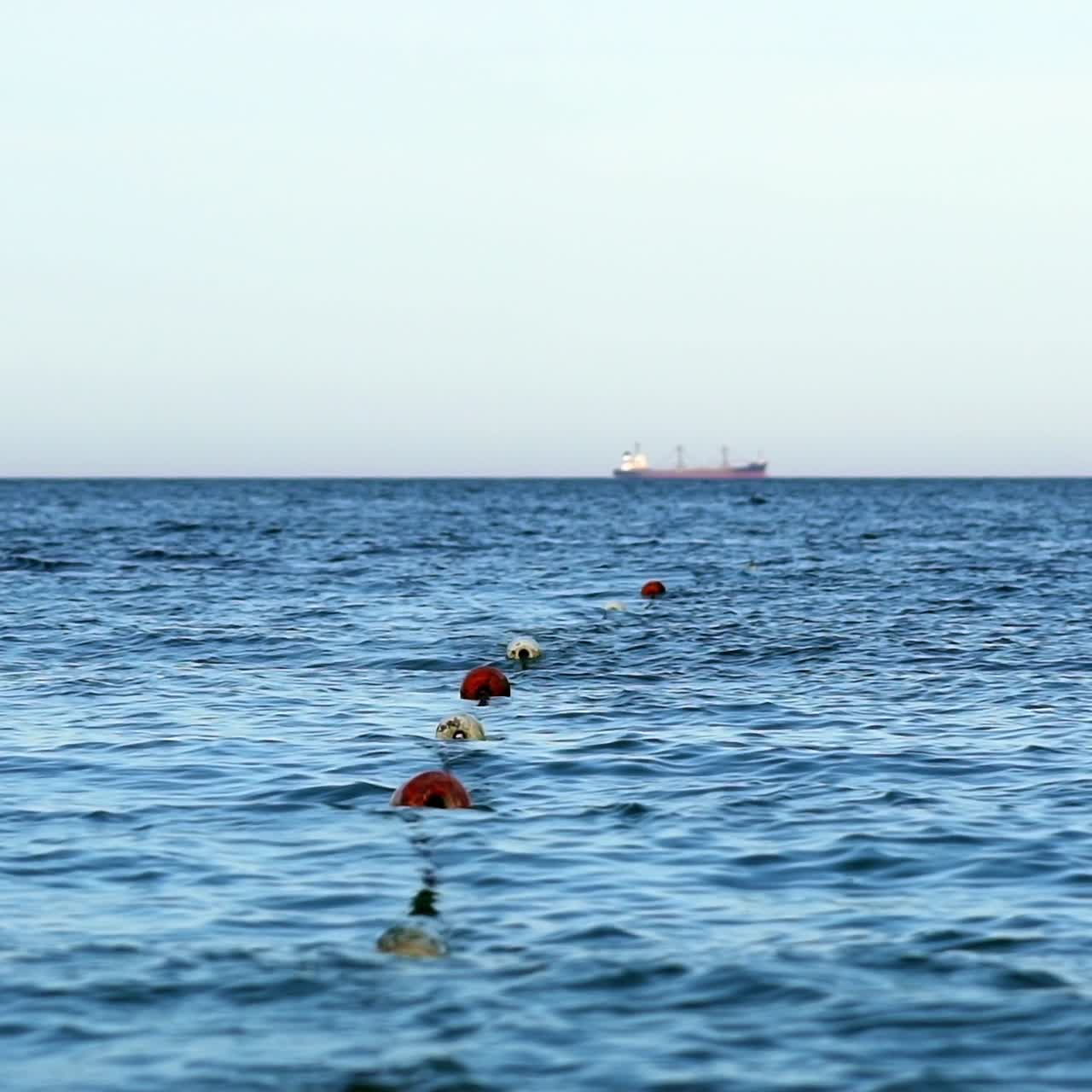 Floating buoy on blue sea