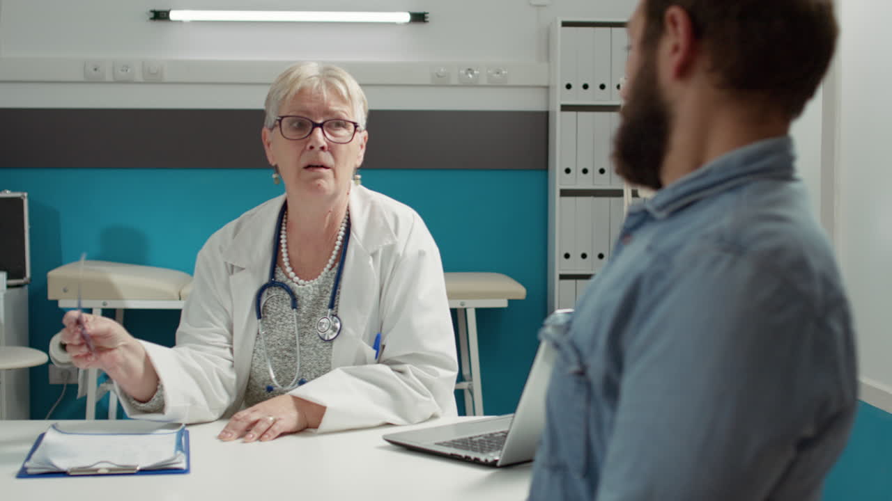 Female physician giving diagnosis with x ray scan results to patient