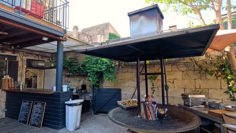 grill in action at a rustic outdoor kitchen