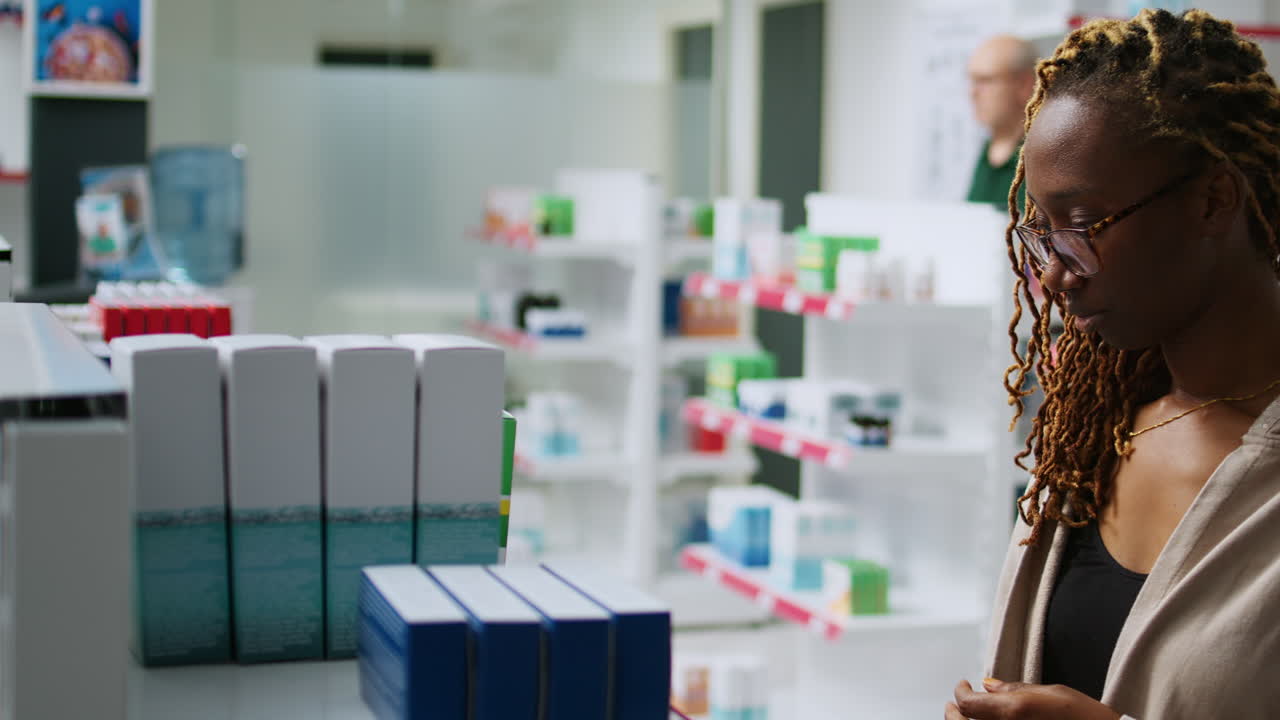Customer in a pharmacy looking at medication
