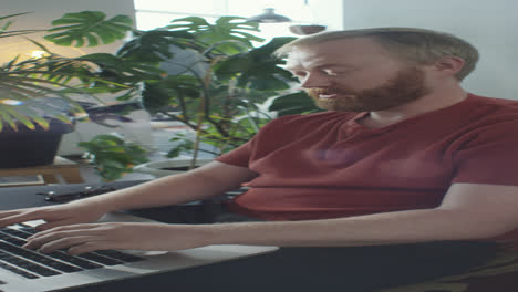 man working remotely laptop from home