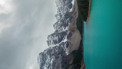 Vertical-4k-Time-Lapse,-Clouds-Above-Snow-Capped-Mountain-Peaks-and-Turquoise-Glacial-Lake-Water