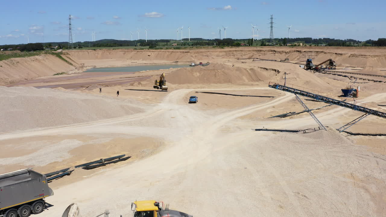 Aggregate Materials Extraction At Open-pit Mine - Rocks, Sand, And Gravel Transported By Conveyor Belt System. - aerial shot