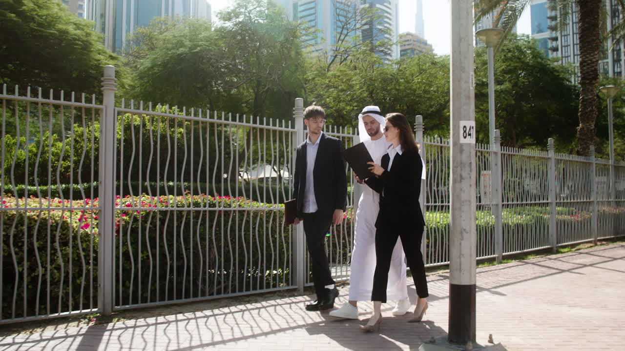 Three people talking about business