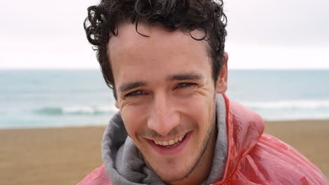 excited young man cheerfully laughing on a cold