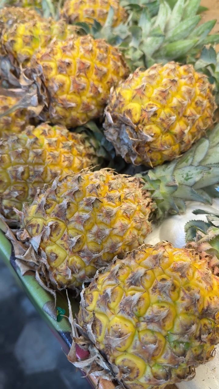 Close-up View of Fresh Ripe Pineapples on Display