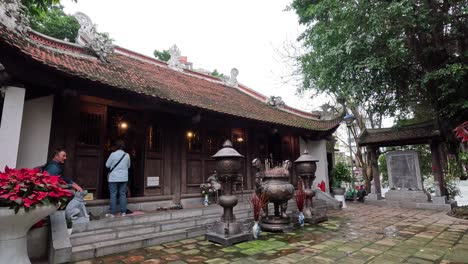 visitors explore a traditional vietnamese temple