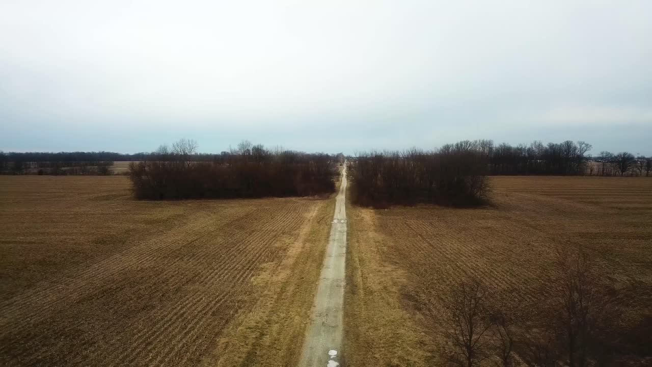 Aerial view of narrowed countryside off road leading to the city of Westfield in Hamilton County, Indiana