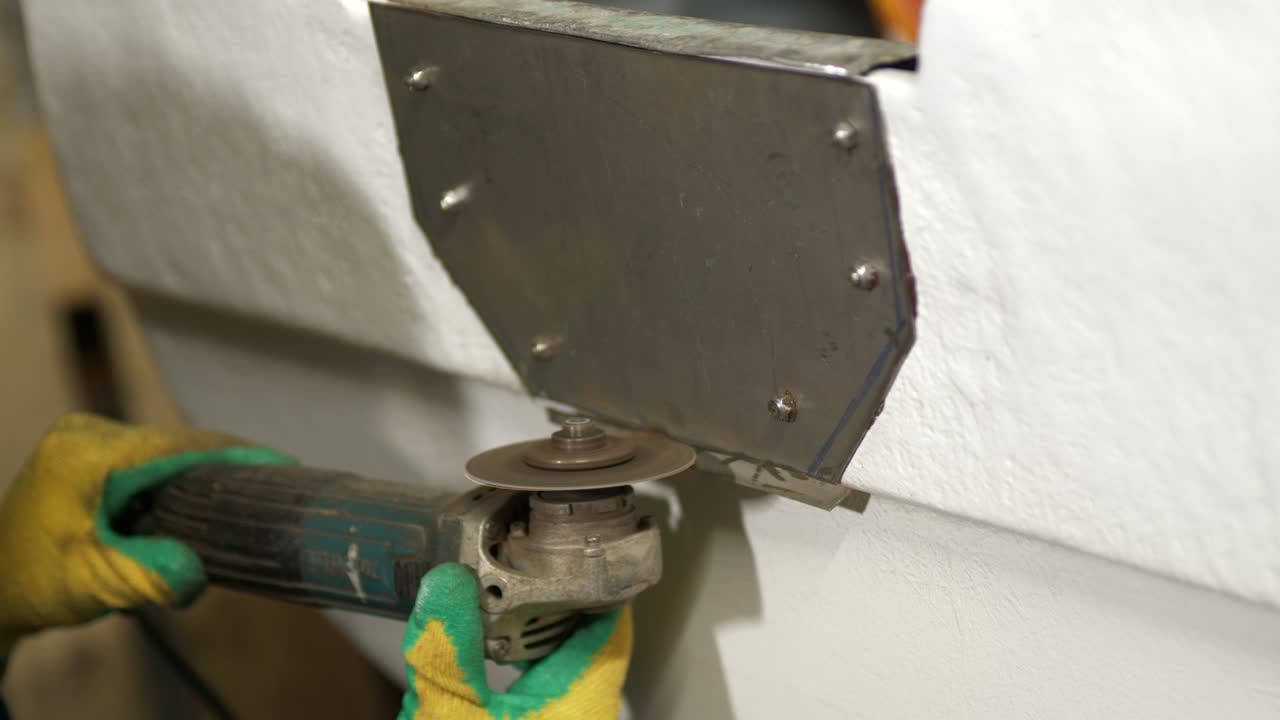 Cutting steel plate on boat transom using angle grinder
