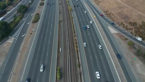 Pan-up-over-highway-with-traffic-in-the-smokey-hills-of-the-Bay