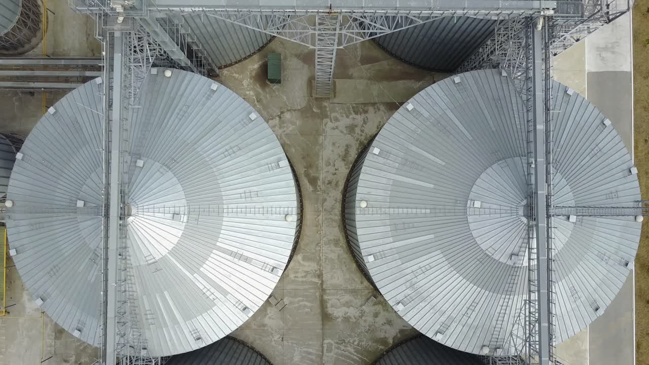 Container for storage of crop. Big group of grain dryers complex for drying grain