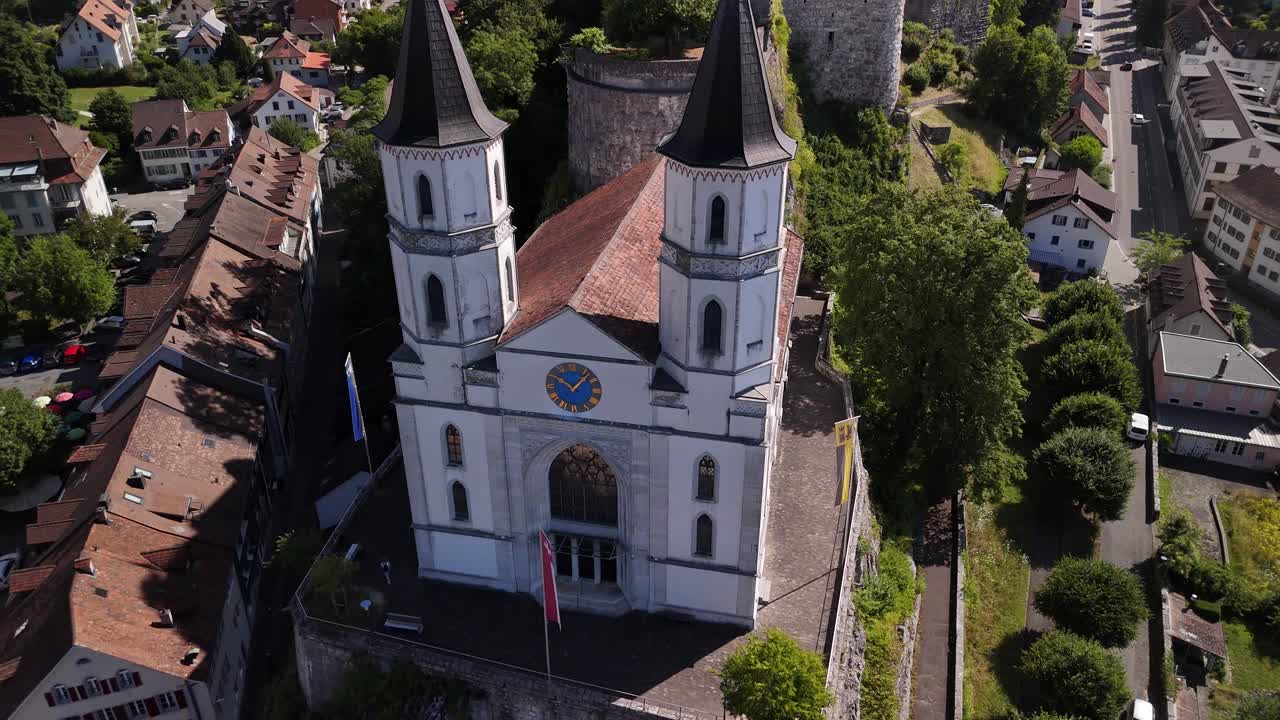 Above Aarburg castle and Aarau reformed gothic church Switzerland aerial drone