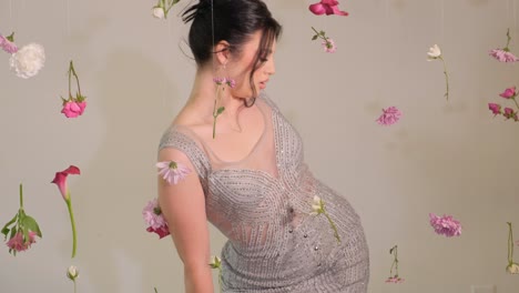 a graceful model elegantly poses amid a breathtaking display of suspended flowers a graceful model elegantly poses amid a breathtaking display of suspended flowers highlighting her beauty and elegance