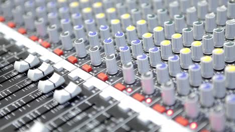 Dj-Working-On-A-Audiomixer-At-Studio-Close-Up