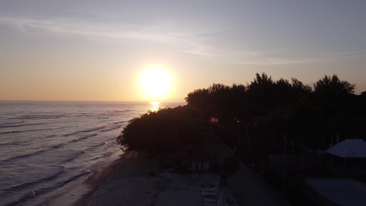 Stunning Golden Sunset Over a Tropical Beach and Ocean