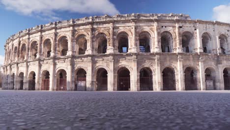 roman arena in south of france, empty scenery of a tourist site in france during covid-19 lockdown pandemic, on a sunny day