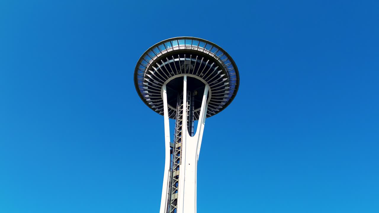 Drone aerial of the Space Needle tower observation viewpoint urban building landmark attraction in heart of Seattle city CBD Washington USA America tourism waterfront architecture engineering