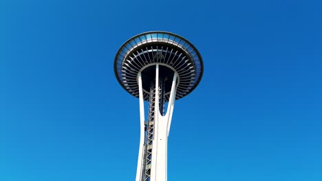 Drone aerial of the Space Needle tower observation viewpoint urban building landmark attraction in heart of Seattle city CBD Washington USA America tourism waterfront architecture engineering