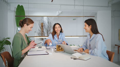 women discussing business project in office. corporate managers working together