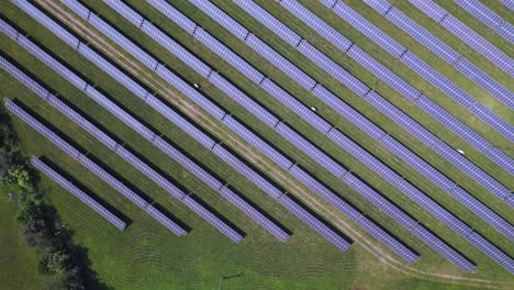 smooth aerial top view flight solar field plant factory at village chlum, czech republic summer 2023