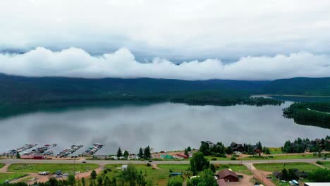 Beautiful-Grand-Lake-in-the-Colorado-Rocky-Mountains-with-Clouds-Reflecting-on-Water-on-a-Calm-Summer-Day