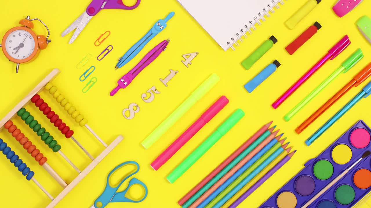 Back to school creative pattern made of school stationery on yellow theme. Stop motion