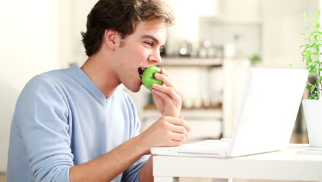 Healthy-man-eating-green-apple