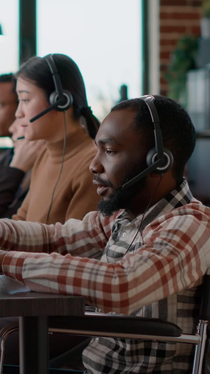 Call center employees working in an office
