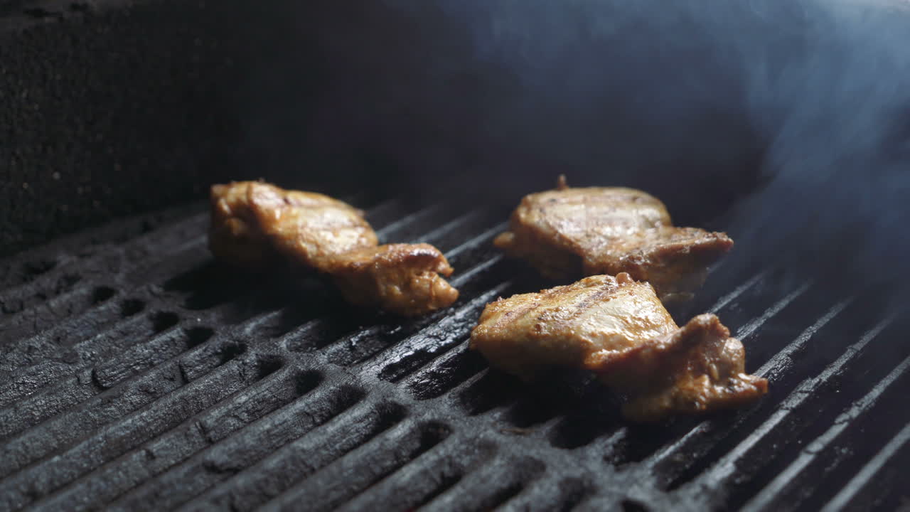 Preparation of delicious meat steaks on the grill. Barbecue. Delicious food.