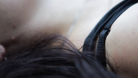 Bohemian-Free-Spirited-Female,-Laying-on-the-Grass-in-Nature,-Close-up-on-the-Neck-and-Hair