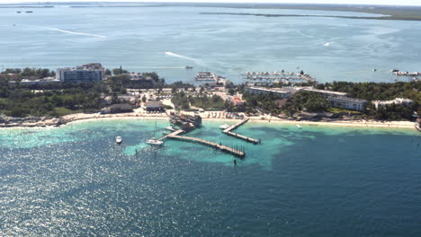 sea piers on sandy tropical beach with holiday resort in cancún