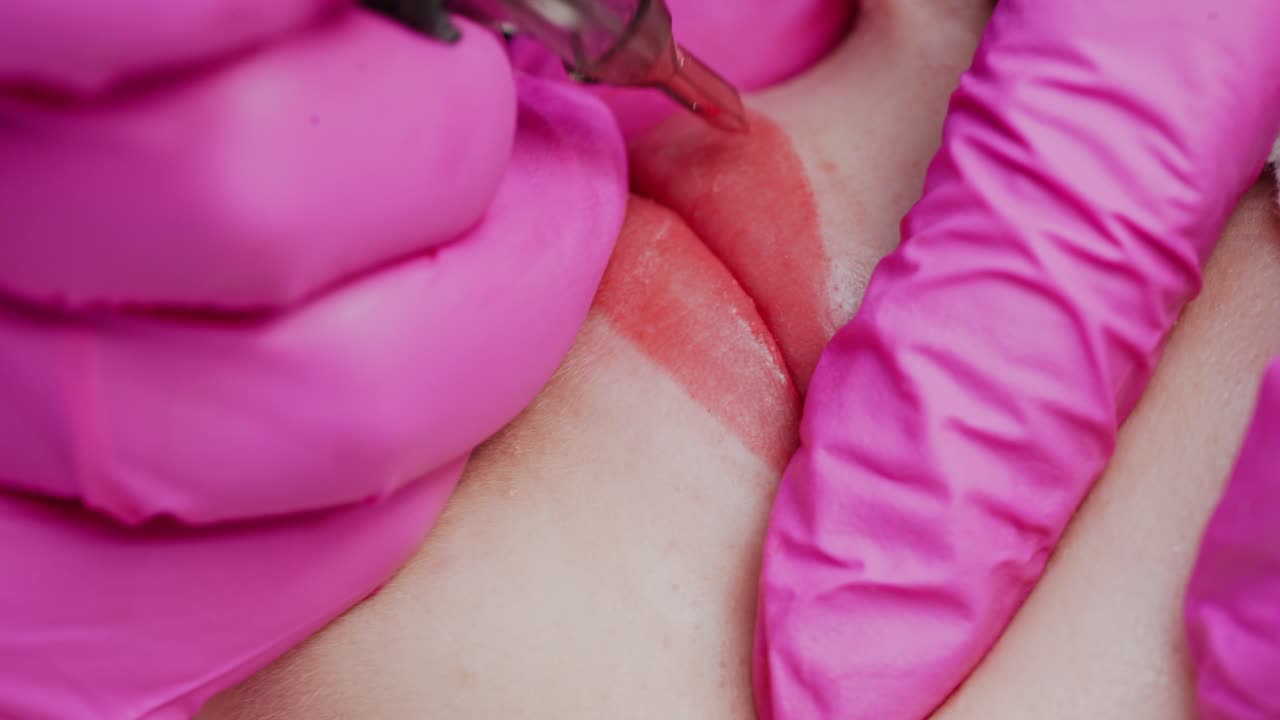 Permanent make up procedure. Young beautiful woman making permanent makeup in cosmetology salon