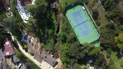 landslide in middle of villas, natural disaster in la - birds eye aerial view