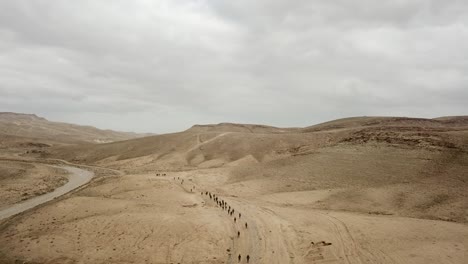 drone shot of hundreds of israel soldier troops walks during military operation