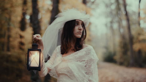 lost bride with a lantern in an autumn forest