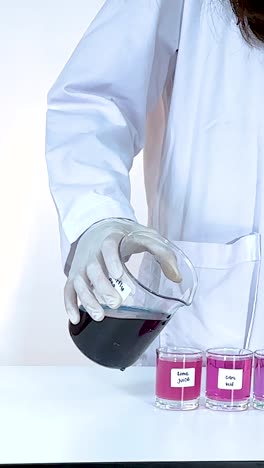 scientist pours liquid into test tubes, observing color changes. bright lighting highlights the chemical reaction process