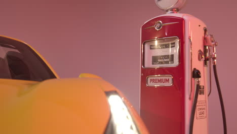 4k-slide-around-oldtimer-gas-pump-that-is-behind-a-yellow-Ferrari-488