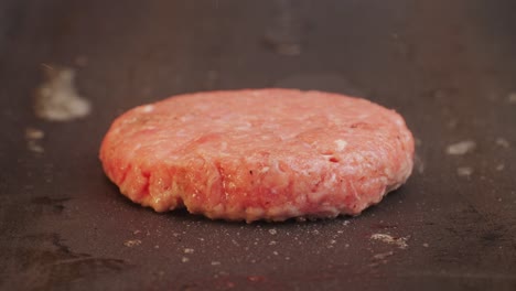 cooking american fat smash burger on grill close-up. beef or pork cutlet smashing by burger press. the chef in kitchen of the restaurant making cutlets for burgers - smash burger beefsteak. fast and street food concept. high quality 4k footage