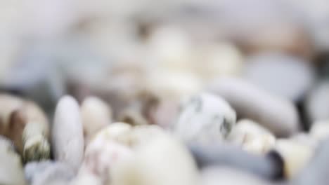 Moving-camera-over-small-pebble-stones-in-different-colours