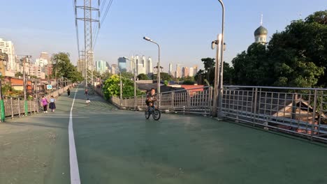 cyclists and pedestrians enjoying a sunny day in the park