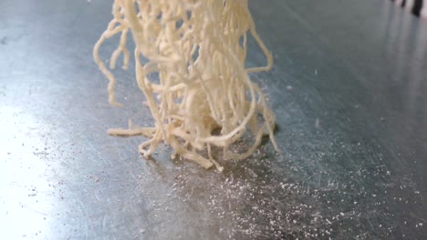 thai styled tom yum noodles contained with egg noodles, minced pork cake, pork liver and intestine, bean sprouts, spices and grounded peanut, one of the favourite street food in thailand