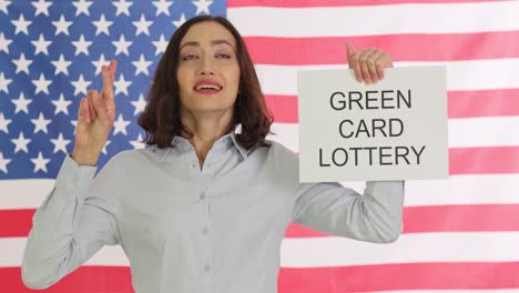 woman hoping for green card lottery win in front of american flag