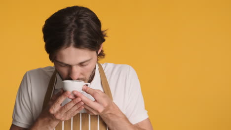 Caucasian-man-in-front-of-camera-on-yellow-background.