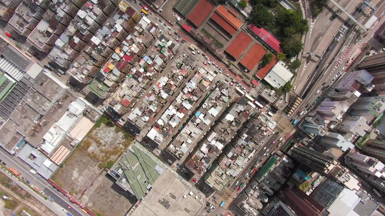 Hong Kong Kowloon Walled City, a densely populated slum, Top down pull up spin aerial view.