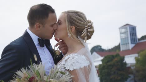 Bride-and-groom-kiss-romantically